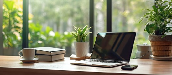 Fototapete - Home office featuring a modern laptop on a desk providing a comfortable workplace with ample copy space for text