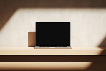 Wall Mural - apple macbook pro on the wooden desk on a plaster background