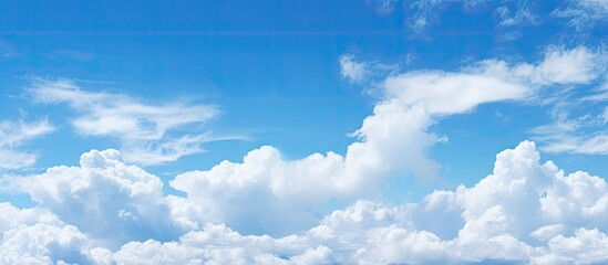 Aufkleber - The expansive blue sky with fluffy clouds as a copy space image