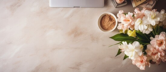 Poster - A beautiful home office table desk with fresh flowers a marble tray a rattan casket and albums Flat lay top view Copy space image