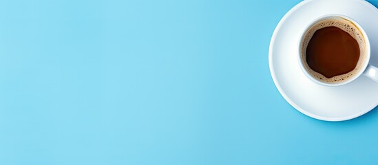 Leinwandbilder - Blue background with a flat lay of an empty white coffee cup providing ample space for text