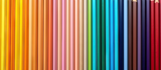 Poster - Colored pencils arranged on a blank background creating an image with ample copy space 92 characters