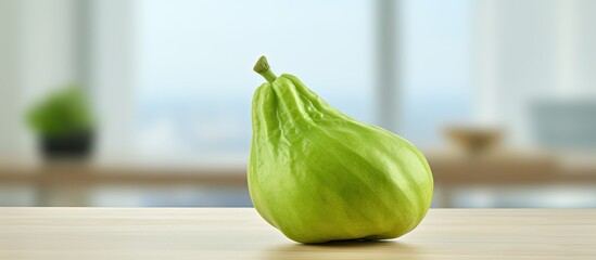 Aufkleber - Close up of a vibrant green chayote on a table providing ample copy space for text