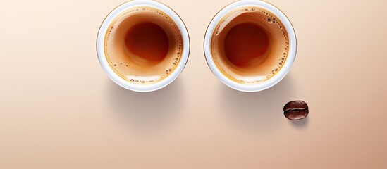 Aufkleber - Coffee cup with two coffee capsules on top displayed from a bird s eye view perspective A flat lay image suitable for copy space