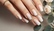 © nino - Closeup to woman hands with elegant neutral colors manicure