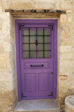 Fototapeta Lawenda - Old Greek era Purple painted wooden door in Alacati, Turkey
