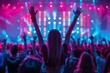 © Trichaiwat - Vibrant crowd enjoys a lively concert, with colorful lights and enthusiastic fans raising their hands in a festival atmosphere.