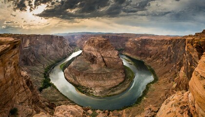 Wall Mural - A dramatic canyon landscape with a winding river at the bottom.
