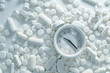 © Image-Love - A white pill bottle with a white clock on top of it. The clock is showing the time as 11:55