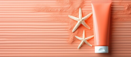 Poster - Flat lay image showing sun protection care with sunscreens and starfish on a coral background with ample copy space