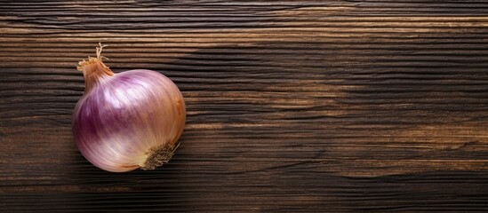 Aufkleber - A top down view of a Crimean sweet onion placed on an aged wooden surface creating an appealing copy space image
