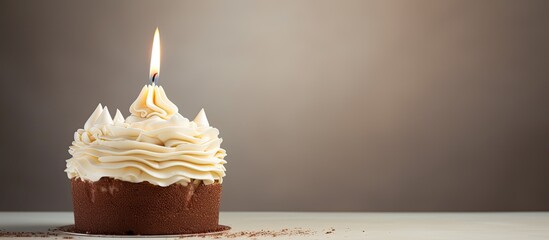 Poster - A cake with a single candle on top perfect for celebrating birthdays presents a captivating copy space image