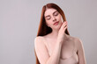 © New Africa - Portrait of beautiful woman on grey background. Space for text