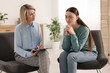 © New Africa - Professional psychotherapist working with patient in office