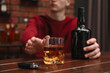 © New Africa - Man reaching for alcoholic drink at table with car keys, closeup. Don't drink and drive concept