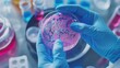 © Darya - a scientist holding a petri dish with a pink liquid in it