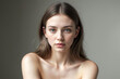© jjfarq - Portrait of a Young Woman With Blue Eyes and Natural Makeup in a Studio Setting.