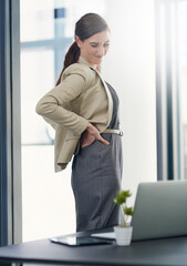 Canvas Print - Woman, office and back pain or ache with laptop for research, overtime and deadline. Female employee, tired and suffering from muscle or joint inflammation, injury and exhausted with work load