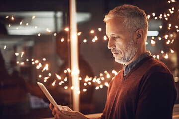 Poster - Night, research and mature businessman with tablet for reading, website review or online report for business opportunity. Networking, communication and man at work with digital app in dark office