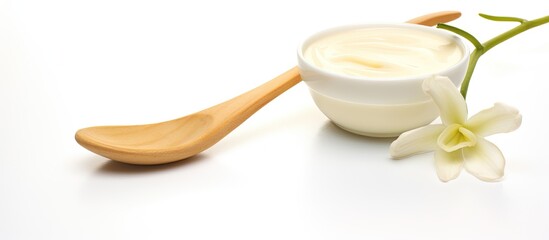 Poster - Copy space image of vanilla sticks and a spoon on a white background emitting a delightful aroma