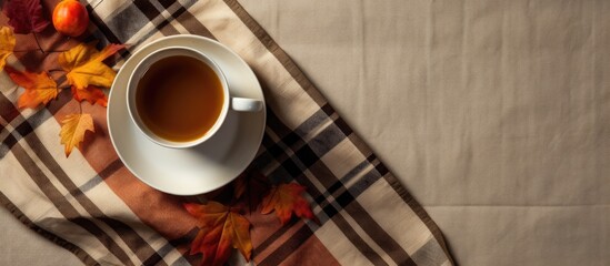 Poster - Autumn composition Cup of coffeecup autumn leaves on on white checkered cloth Flat lay top view copy space