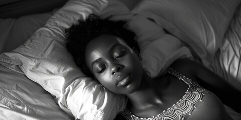 Aufkleber - A woman peacefully resting in bed, suitable for relaxation concepts