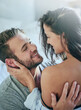 © peopleimages.com - Love, romance and couple in bed with smile, affection and morning bonding in apartment. Relationship, man and woman in bedroom with intimate embrace, passion and relax with care on weekend in home