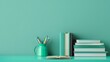 © Tirawat - Minimalist Study Desk with Books and Pencils Against Teal Background