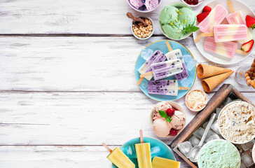 Poster - Cool summer food side border. Assorted refreshing ice cream, popsicle and frozen treats. Above view on a white wood background.
