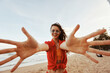 © SHOTPRIME STUDIO - Smiling Woman Embracing Freedom: A Colourful Summer Portrait by the Ocean