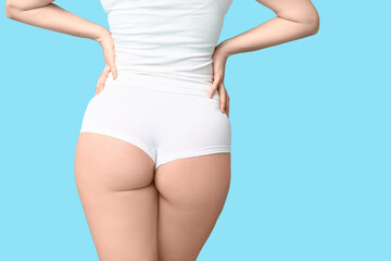 Sticker - Body positive woman in underwear on blue background, back view