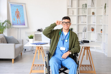 Wall Mural - Young male doctor in wheelchair at hospital