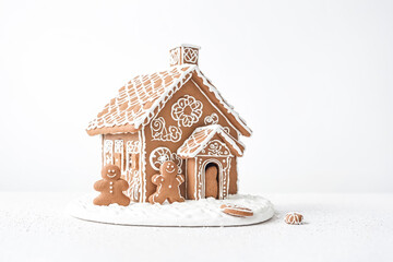 Canvas Print - Gingerbread House with Gingerbread Men on White Background