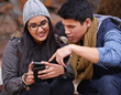 © peopleimages.com - University, phone or friends in campus park for study research, feedback or results survey. College, smartphone and gen z students with sign up app for elearning, registration or virtual tutor search