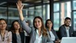 © PhotoPhantasm - a female executive raising her hand to volunteer