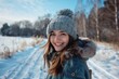 © Popelniushka - Happy Woman In Winter. Portrait of Young Woman Laughing in Wintery Landscape with Copy Space