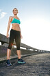 © peopleimages.com - Sports, energy and woman on bridge for running with race, marathon or endurance training. Fitness, health and female athlete runner with cardio workout on break by highway for outdoor exercise.