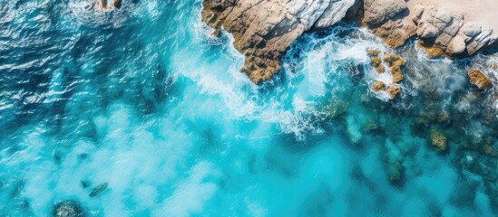 Canvas Print - Bird s eye view of a tropical seascape with rocky terrain and vibrant turquoise waters ideal for a copy space image