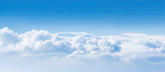 Poster - A serene cloud in shades of blue and white drifts gracefully across a clear sky ideal for a copy space image