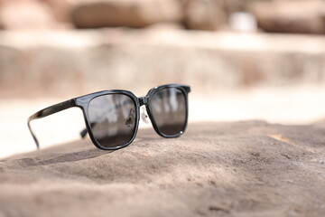 Canvas Print - sunglasses on sand