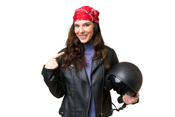 Wall Mural - Young caucasian woman with a motorcycle helmet over isolated background giving a thumbs up gesture