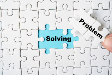 Poster - Hand holding problem wording on jigsaw and assemble to solving wording for creative thinking idea solution concept.