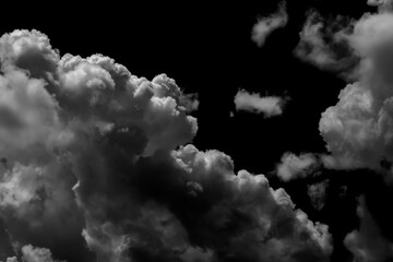 Wall Mural - Separate white clouds on a black background have real clouds. White clouds isolated on a black background are realistic clouds, Smoke explosions abstract clouds