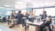 © DMegias - Cheerful businesspeople reaching for currency notes thrown by managers at office