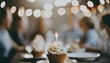 © anastasiia - Birthday party. Delicious cakes and cookies are in front, and happy blurred people are celebrating in the background