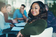 © peopleimages.com - Black woman, boardroom and meeting for portrait, startup and team or colleagues and documents or planning. Person, employee and happy for group, staff and creative for problem solving at media agency