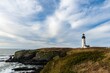 © Wirestock - White lighthouse on the coast against the cloudy sky in summer