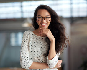 Poster - Creative, design and portrait of woman in glasses at office for small business or startup company. Face, happy and smile with confident designer person in workplace for inspiration or opportunity