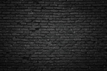 Wall Mural - old blackened brick wall background, dark texture of rough brickwork