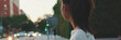 © Andrii Nekrasov - Beautiful happy brunette girl dressed in casual clothes looks around while standing on crosswalk, Panorama